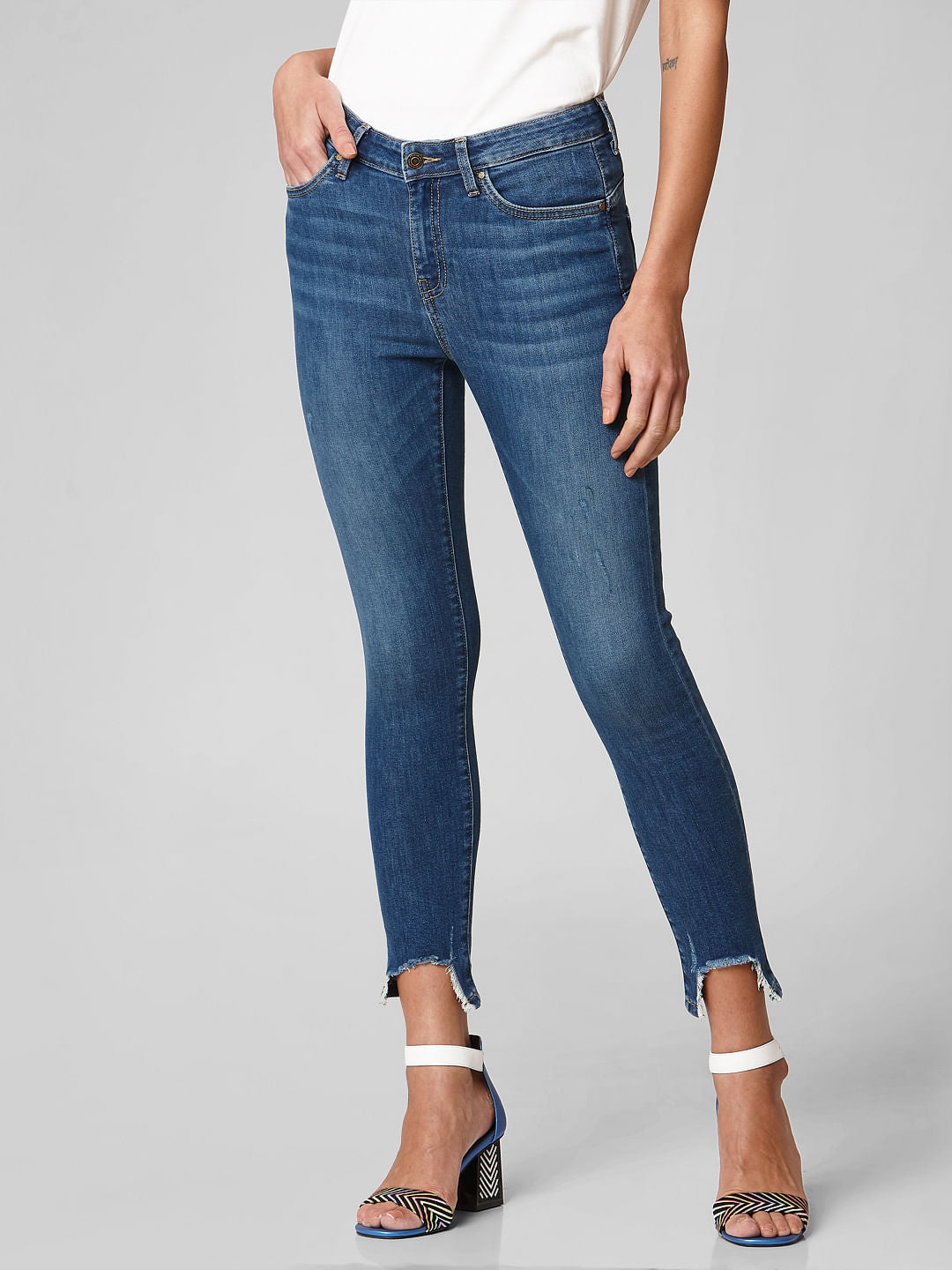 Blue Mid Rise Distressed Hem Skinny Jeans