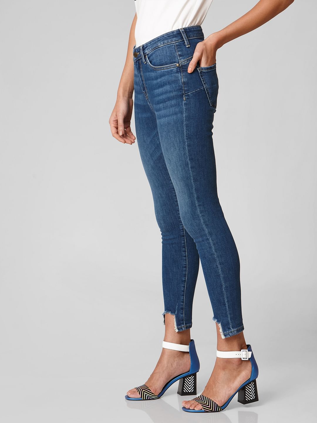 Blue Mid Rise Distressed Hem Skinny Jeans