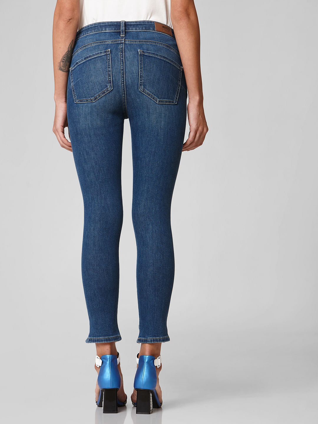 Blue Mid Rise Distressed Hem Skinny Jeans