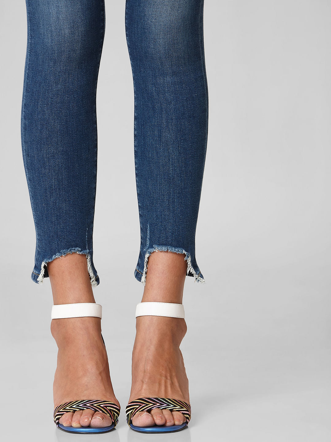 Blue Mid Rise Distressed Hem Skinny Jeans