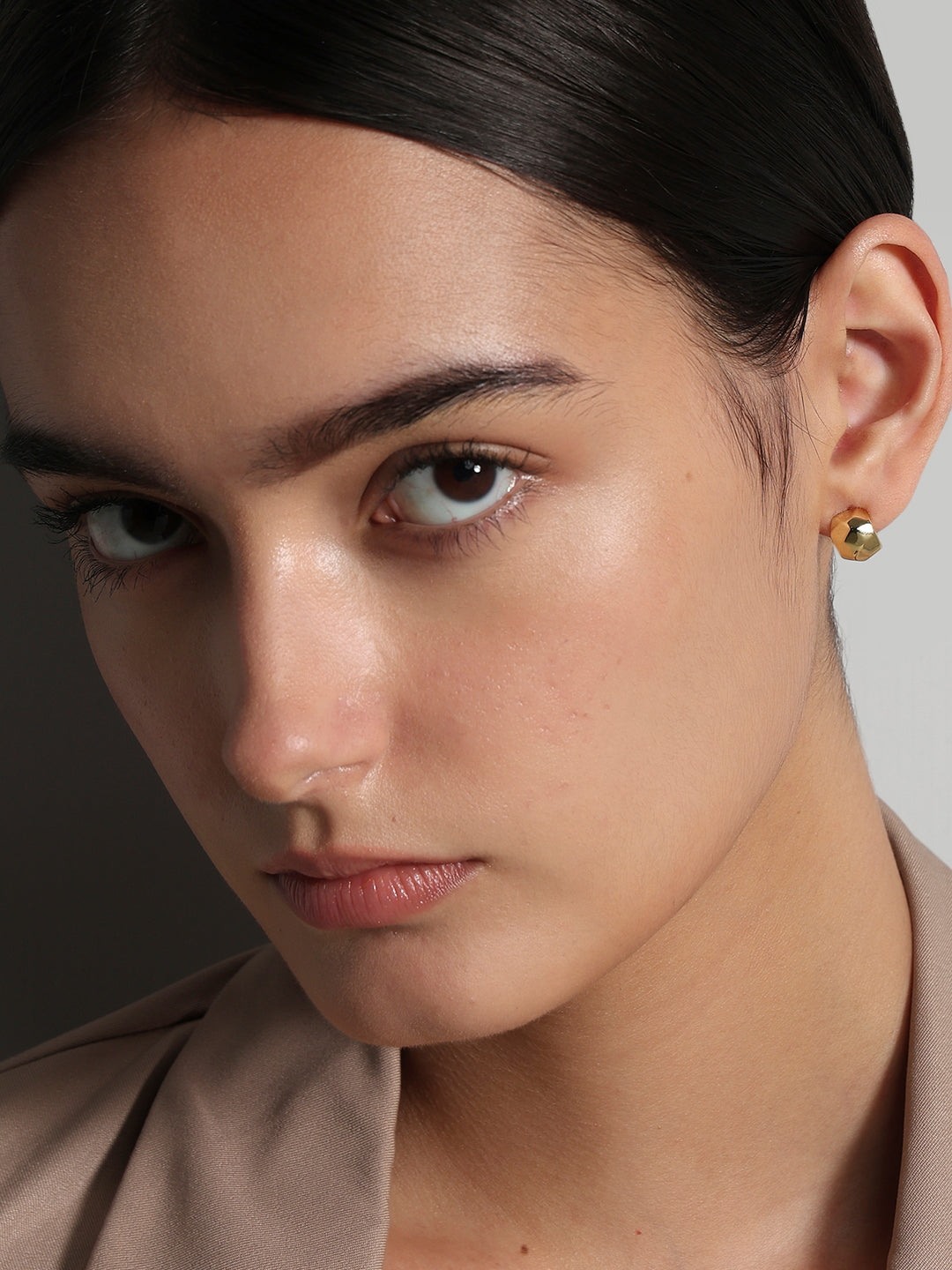 Golden sculpted stud earrings