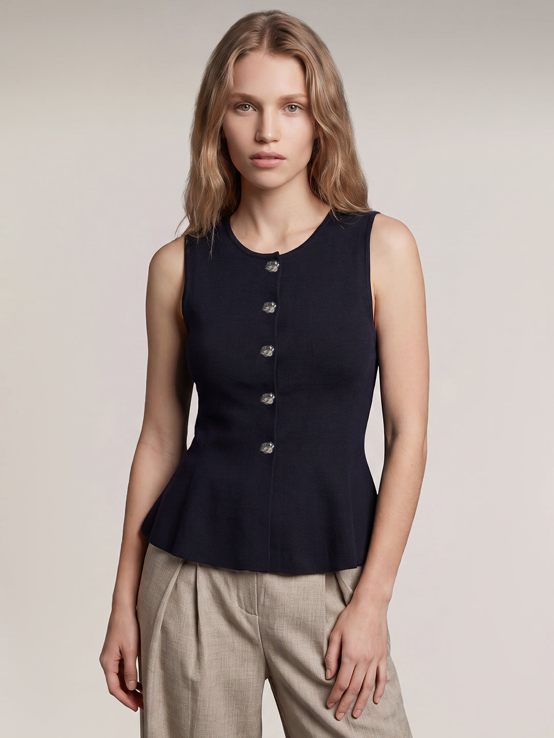 Sleeveless Peplum Knit Top